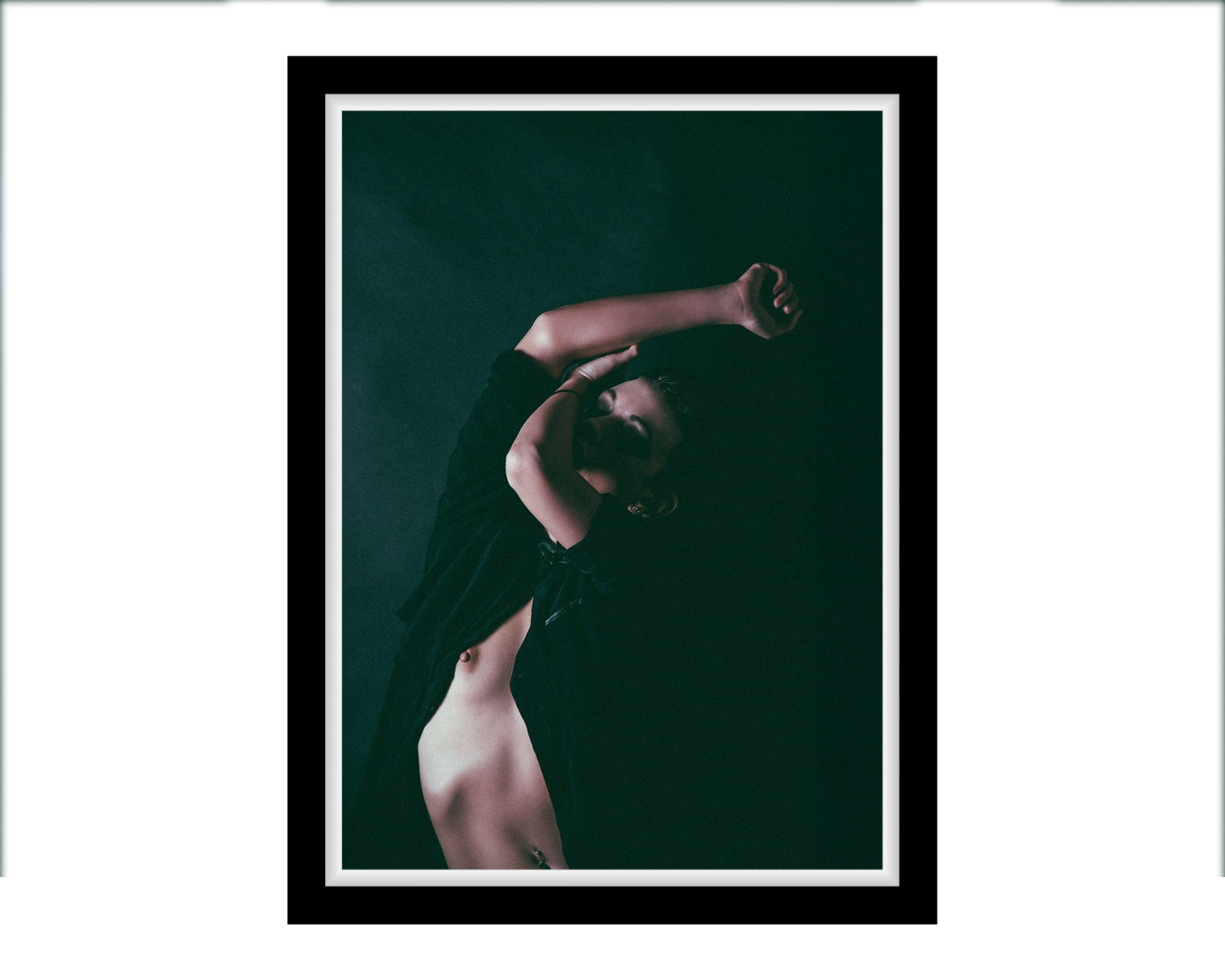 Framed artwork of a person with a dark background