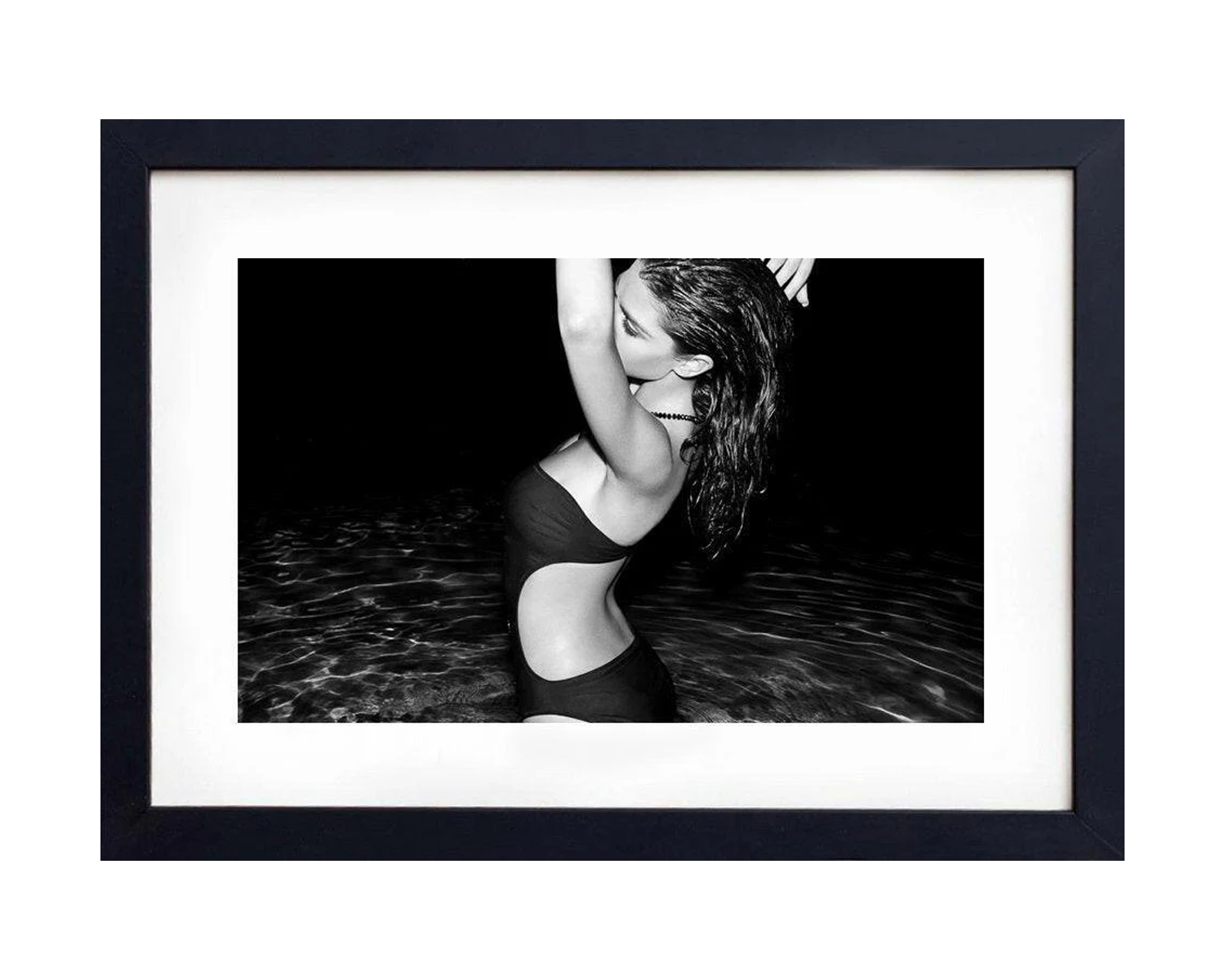 Framed black and white photograph of a person in water